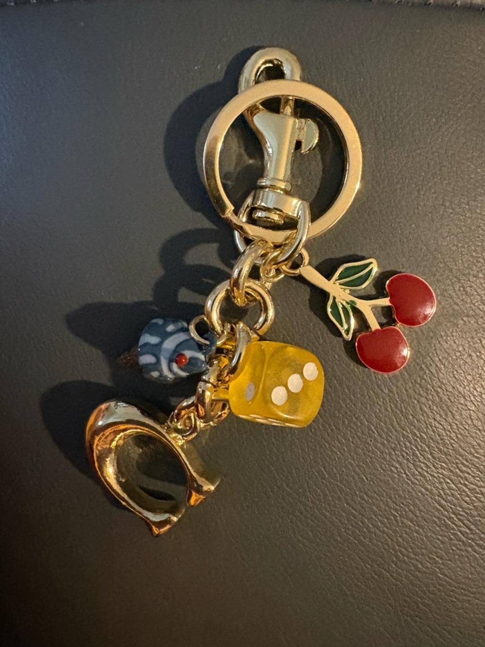 Gold Charm Keychain with Red Cherry and Yellow Dice Charms. NWOT